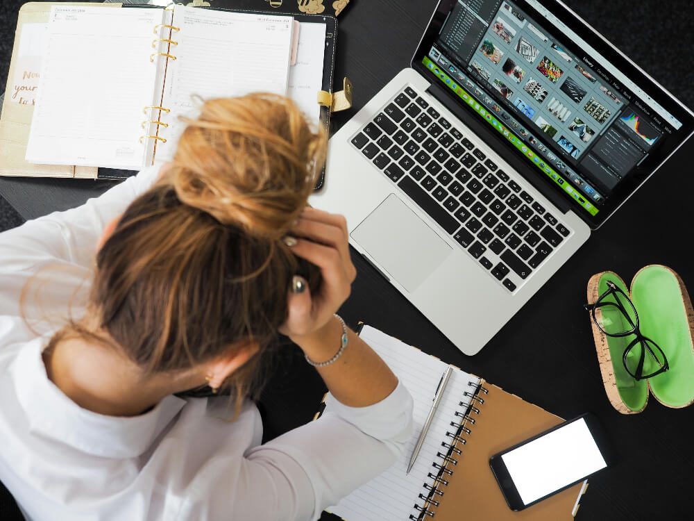 Frustrated girl sitting in front of computer